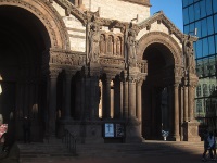 Powerful exterior of Trinity Church recalling Arles Cathedral.